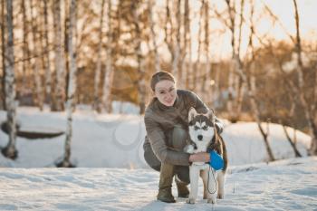 Walk of the girl with the husky.