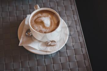 Cup from coffee on a table.