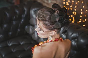 The girl in a red dress in cafe.