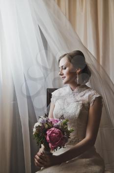 Bride near the window.