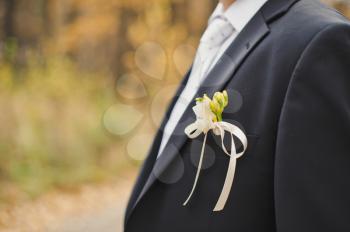 The young man with ornaments in a breast pocket.