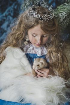 Princess hand with a live ferret in his hands.
