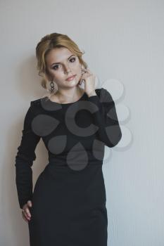 Portrait of a girl in a black dress.