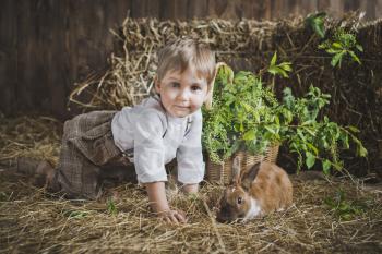 Photosession of children with rabbits.