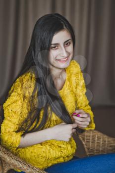 Studio portrait of a girl with long smooth hair.