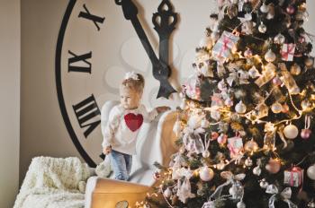 Studio Christmas song from the big Christmas tree and a huge clock face.