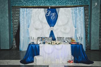 Wedding hall is decorated with fabric.