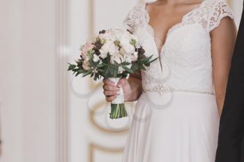 The bride and groom support each other.