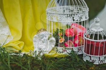 Bird cage with flowers in the garden.