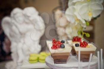 A small table with sweet delicious cake.