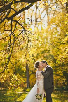 Couple on a walk on a Sunny autumn day.