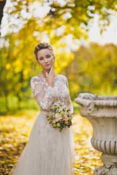 Portrait of the bride during a Sunny autumn day.