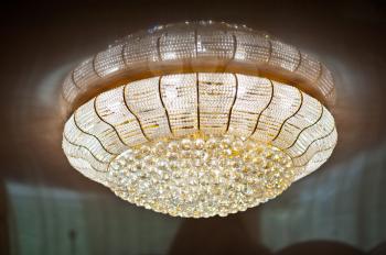 Elegant chandelier in the shape of a UFO.