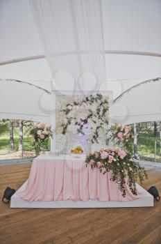 Table for the newlyweds in the tent before the holiday.
