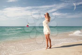 Bride walking along the beach near the ocean