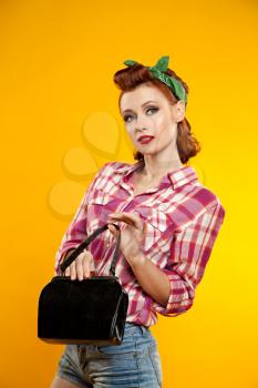 pin-up girl. beautiful young woman isolated on white in studio in old fashion clothes representing pinup and retro style