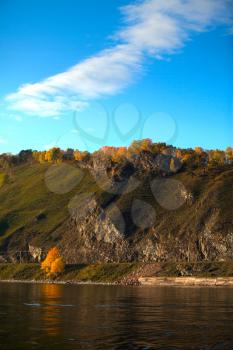 Island on Lake Baikal in the autumn. The most beautiful and wonderful little sea