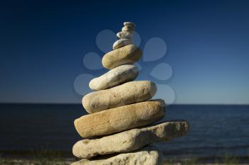 stones stacked on each other on the background of the ocean