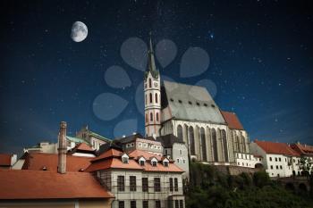 Cesky Krumlov - the city of South Bohemia Czech Republic region. Located on the Vltava River. declared a UNESCO World Heritage Site. night shining moon and stars