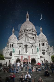 Montmartre Paris. Basilica of the Sacred Heart of Jesus. night shining moon and stars.
