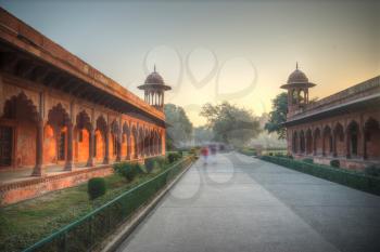 gate through which the Taj Mahal visitors in a park that surrounds the mausoleum