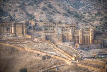 Amber Fort or Amer - fortified residence of Raja in the eponymous northern suburbs of Jaipur, on the crest of a rocky hill behind the lake Maota