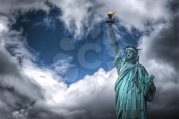 Statue of Liberty Neoclassical sculpture on Liberty Island southwest of Manhattan Island, USA. Clouds in the form of heart