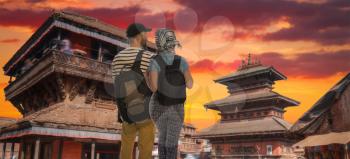 a couple of tourists travel around the city of Kathmandu. Nepal.