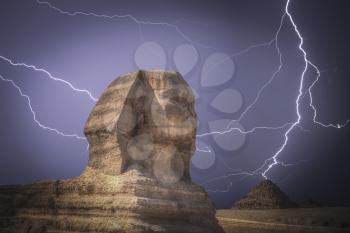 pyramids in Giza. Complex of ancient buildings in Egypt. Powerful lightning strike.