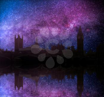 Astrophotography of the night sky. Big Ben and Westminster Palace view from the other bank of the Thames