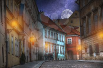 old streets of Prague night. Lights, stars and the moon shine