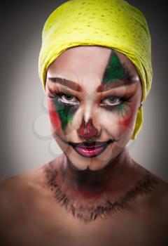 woman in the image of a scary clown on halloween