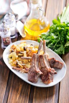 Rack of lamb fried with aromatic olive oil, herbs and spices