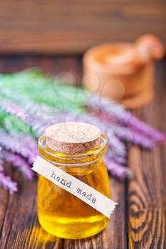lavender oil in bottle and on a table