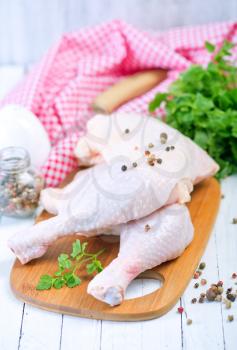 raw chicken legs with pepper and salt