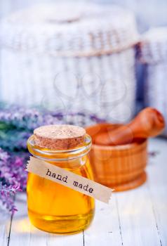 lavender oil in glass bottle on the table
