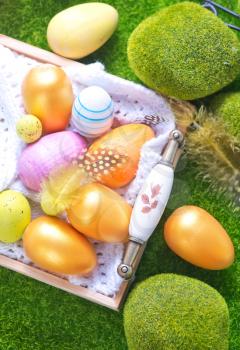 color easter eggs on a table, easter background