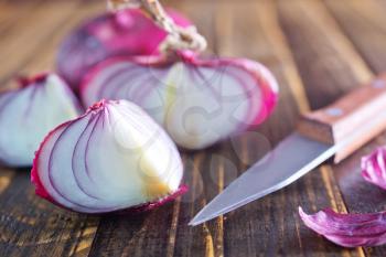 fresh onion and knife on a table