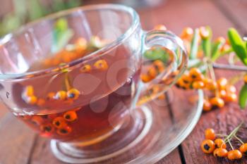 fresh tea in cup and on a table