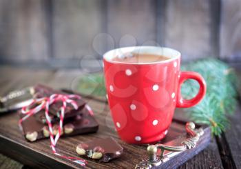 chocolate with hazelnuts and hot cocoa in cup