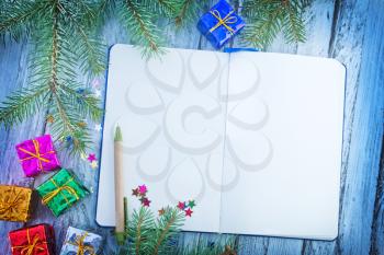 notepad and christmas decoration on a table