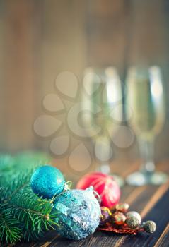 two shampagne glasses and brunch of christmas tree