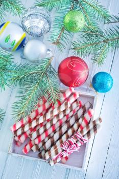 Christmas candy, Christmas treats and a branch of the Christmas tree