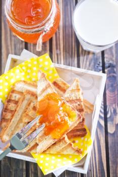 toasts with jam in bank and on a table