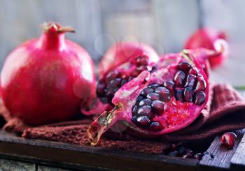 pomegranate on napkin and on a table