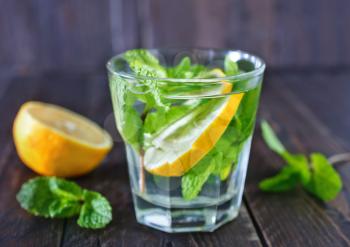 fresh lemon drink with sugar and mint