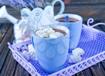 cocoa drink with marshmallows on a table