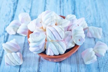 cmarshmallows in bowl and on a table