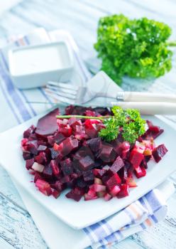 beet salad on plate and on a table
