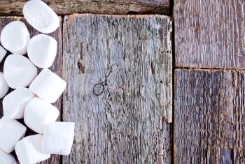 white marshmallows  on the wooden table, fresh and sweet marshmallows